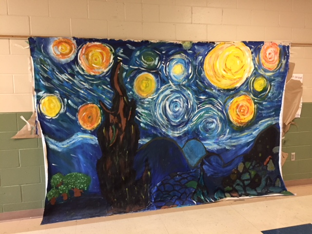 This “starry night” mural was created by Art Club students for the 8th grade dance.